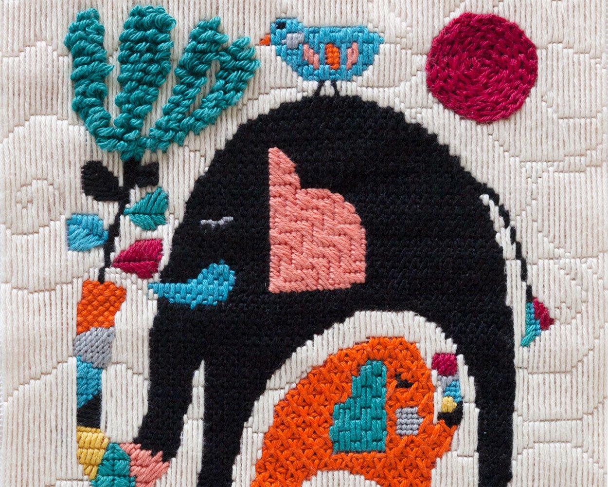 Needlepoint stitched piece with illustration of elephants
