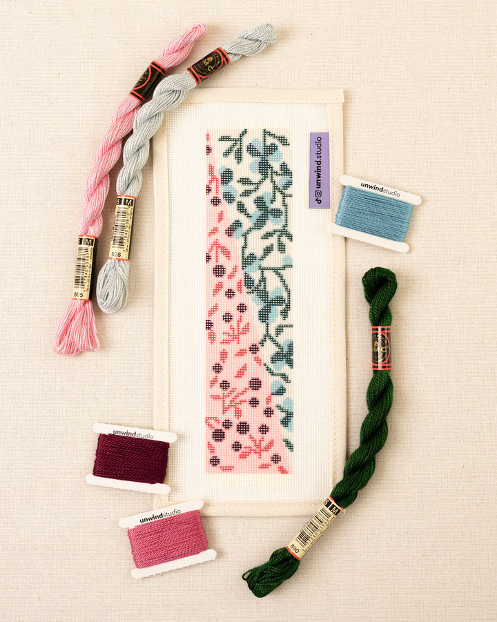 Elinor needlepoint bookmark canvas with a diagonal floral pattern with pink and green tones plus matching threads
