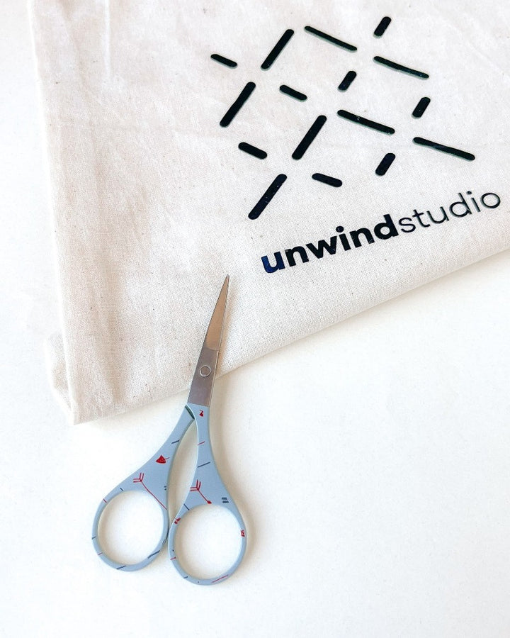 Blue embroidery scissors with cute designs, by Unwind Studio.
