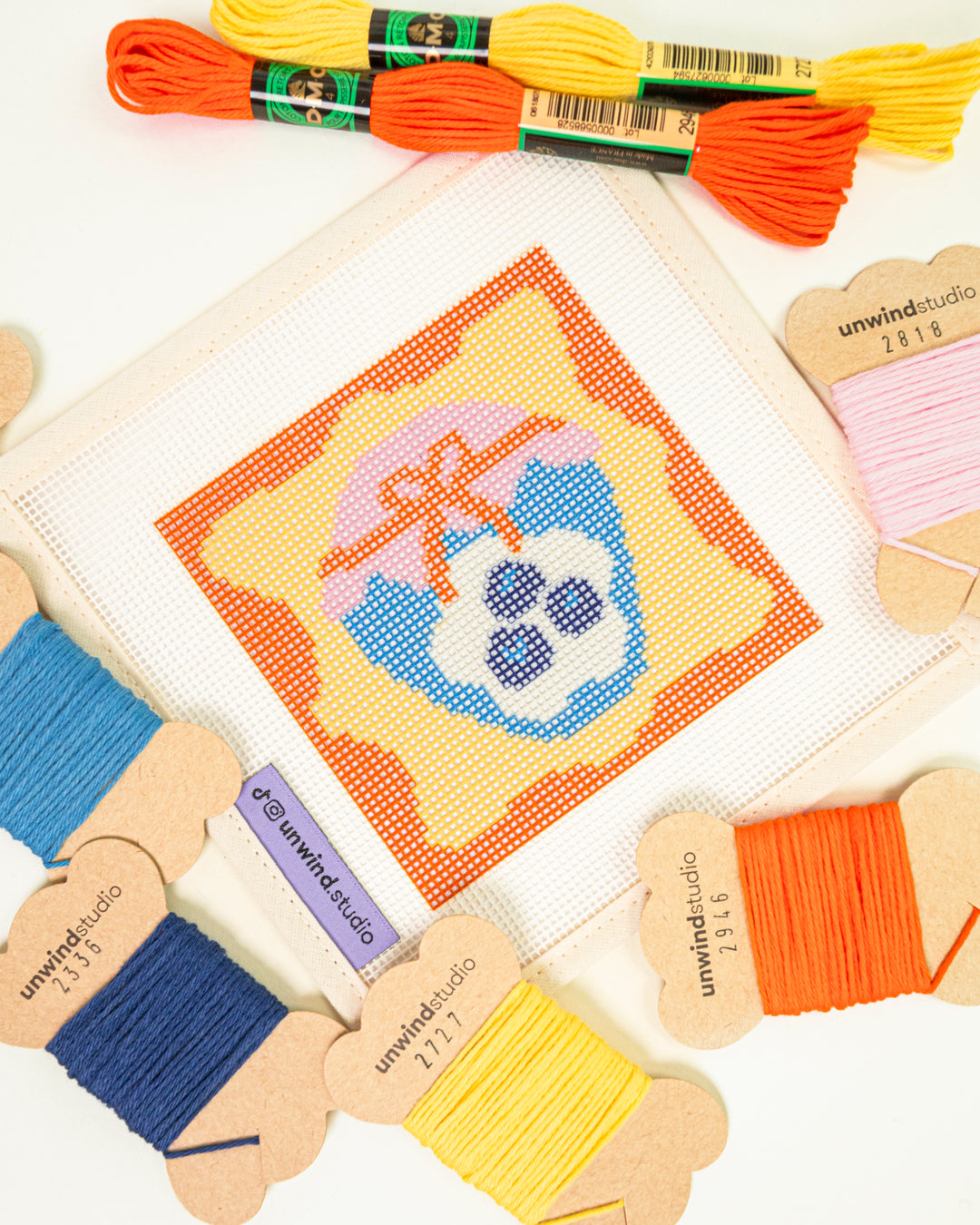 Blueberry Jam-inspired needlepoint coaster kit threads up close with threads