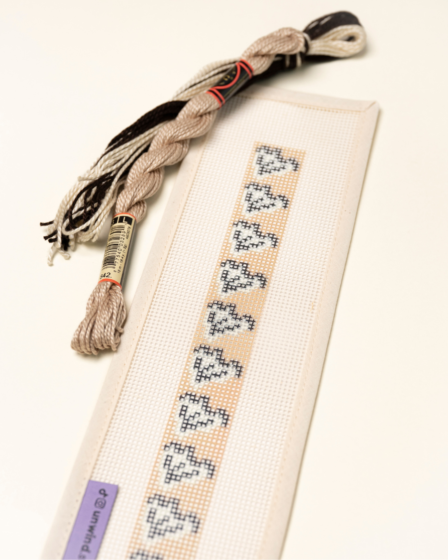 Up-close view of the Clay Leaf Key Fob Needlepoint Kit with matching threads