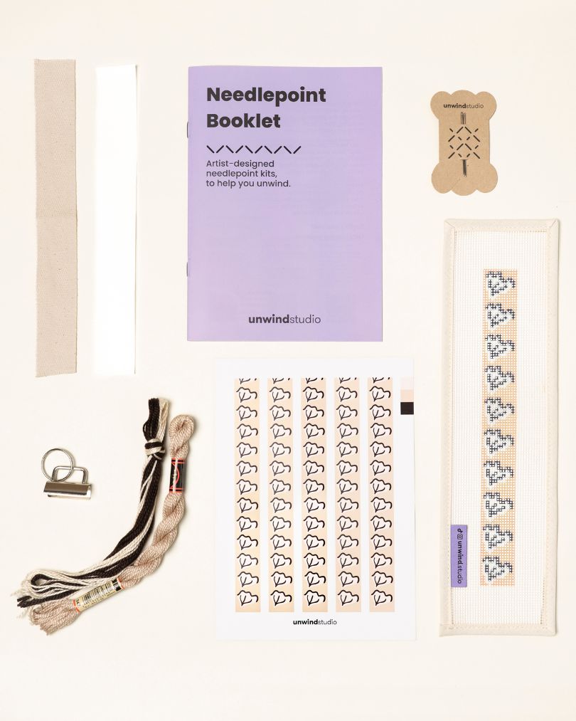 Caly Leaf Complete Needlepoint Kit with finishing materials such as fusible web and cotton twill tape, key fob hardware plus matching threads, set of needles, a graphic flyer and a instructional booklet.