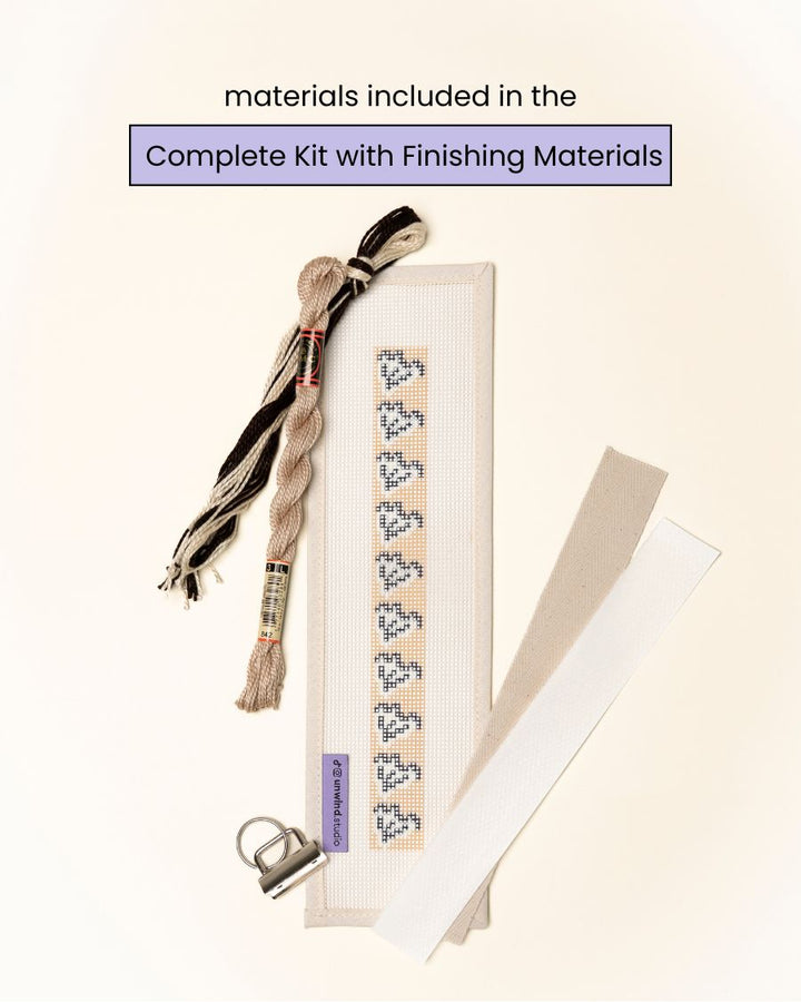 flat view of theClay Leaf Key Fob Needlepoint Kit with printed canvas, matching threads and finishing materials.