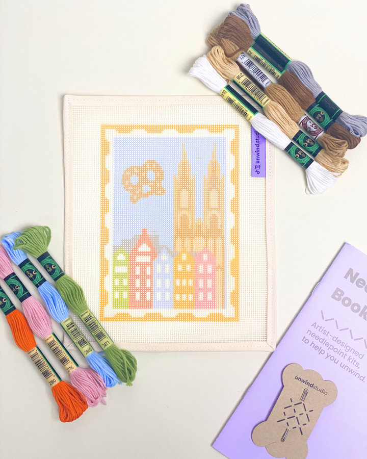 Cologne Stamp Needlepoint Kit displayed closed up