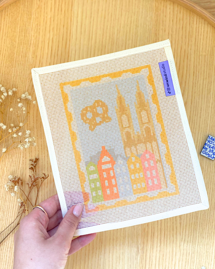 Cologne Stamp Needlepoint Kit in a lifestyle aesthetic