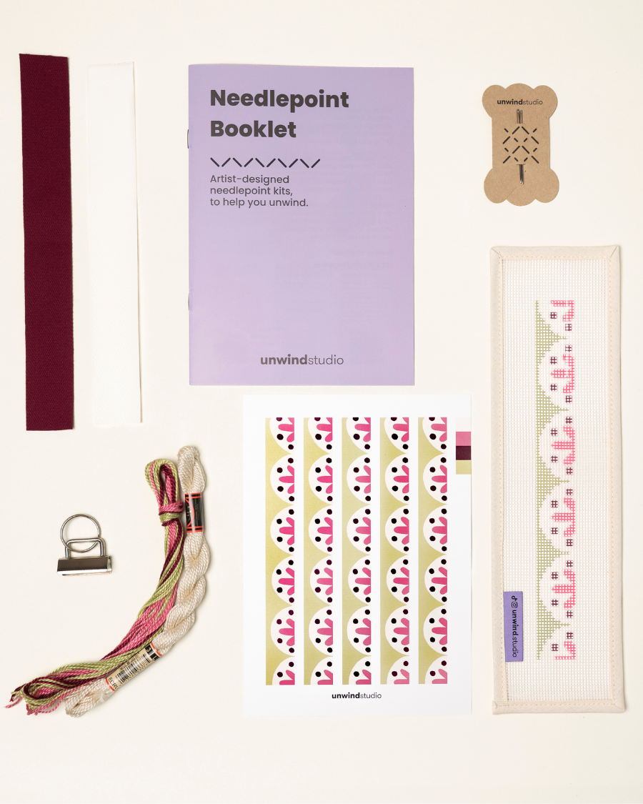 Flourish Complete Needlepoint Kit with finishing materials such as fusible web and cotton twill tape, key fob hardware plus matching threads, set of needles, a graphic flyer and a instructional booklet.