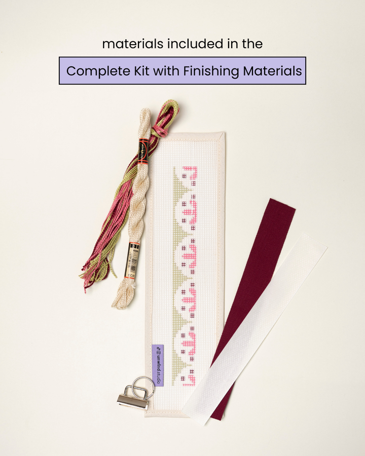 flat view of the Flourish Key Fob Needlepoint Kit with printed canvas, matching threads and finishing materials.