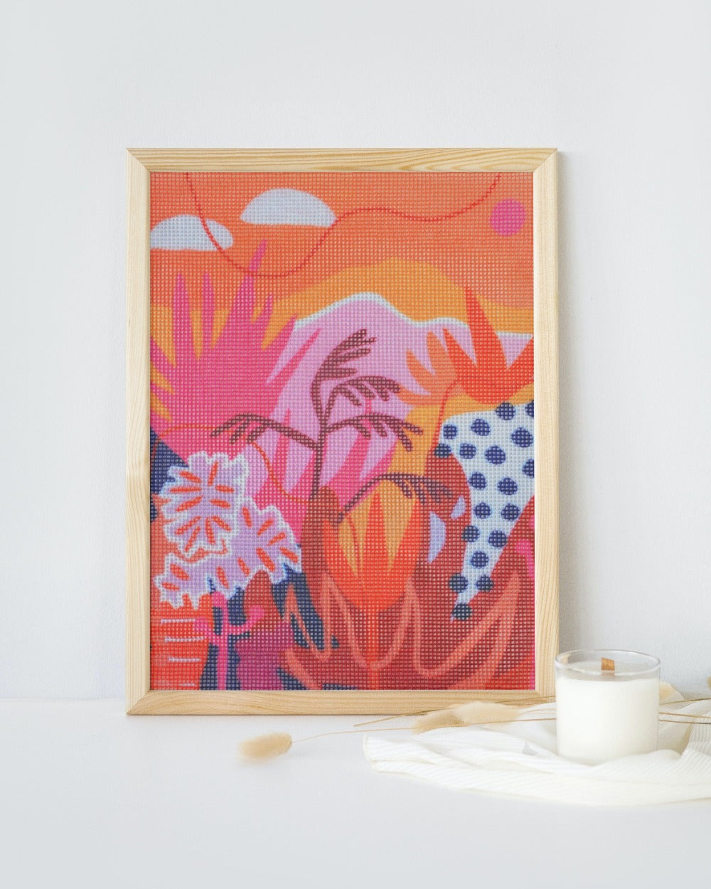 Highnoon abstract and modern design for a needlepoint kit by Unwind Studio in collaboration with artist Ponnopozz. Needlepoint framed for home decor
