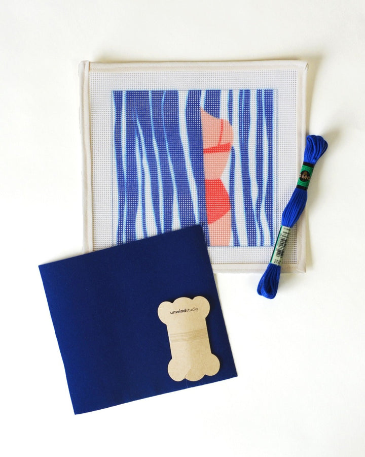 needlepoint kit and canvas with illustration of woman in bikini with water