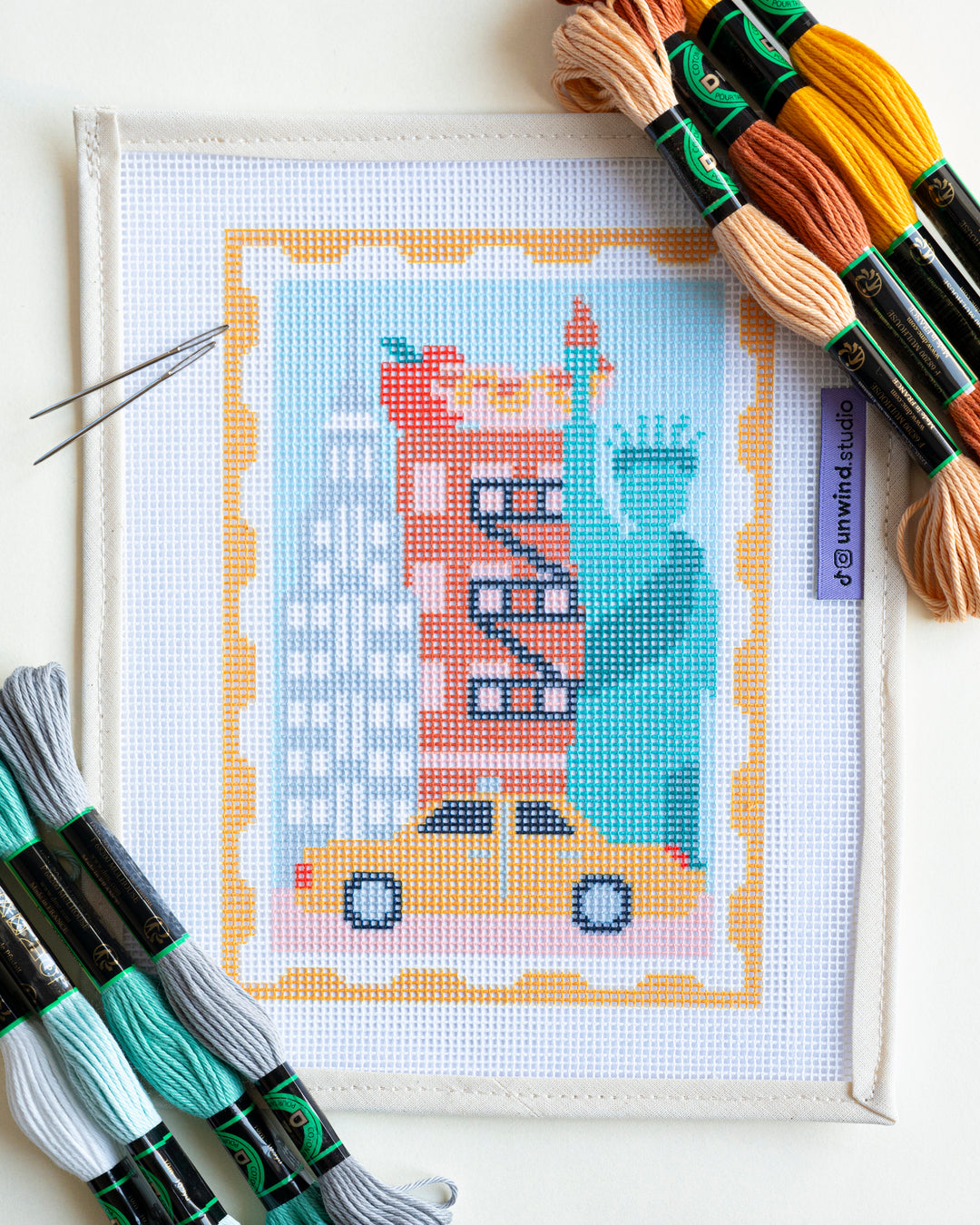 New York Stamp Needlepoint Kit with matching threads, a unique souvenir to remember a special trip.