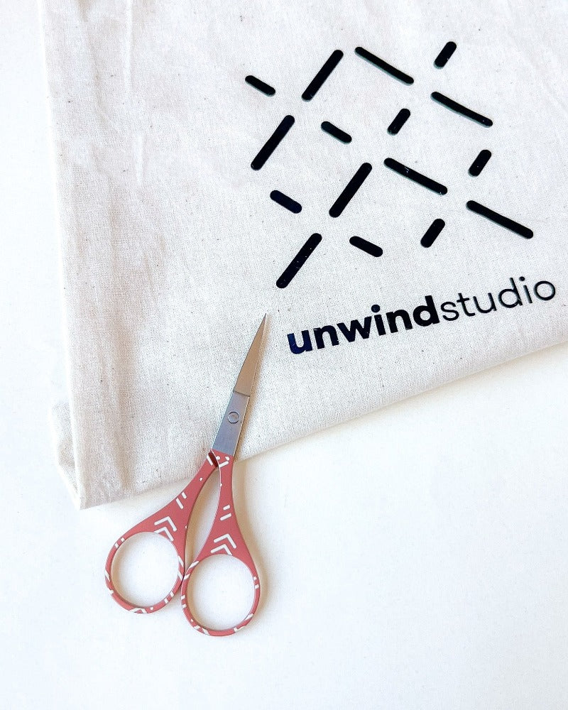 Orange embroidery scissors with cute designs, by Unwind Studio.
