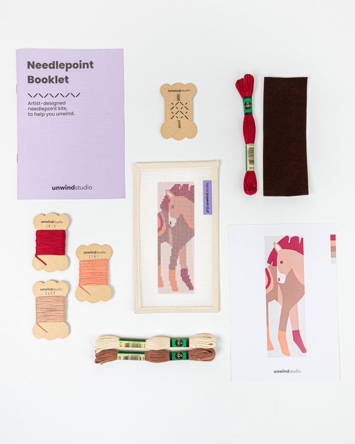 Complete needlepoint bookmark kit for The Horse Spirit design, including the canvas, a instructional booklet, DMC Soft Cotton Threads, finishing materials and flyer.