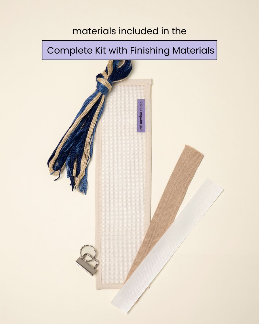 flat view of the Batik Key Fob Needlepoint Kit with blank canvas, matching threads and finishing materials.