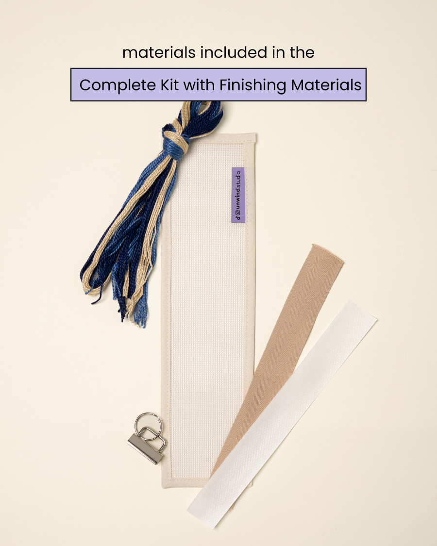 flat view of the Batik Key Fob Needlepoint Kit with blank canvas, matching threads and finishing materials.