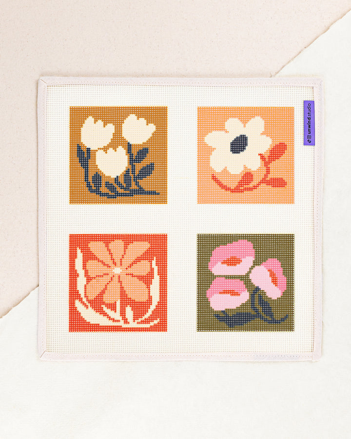 Blossom Coaster Set needlepoint kit by Ophelia Pang: printed canvas of colored flowers, framed with dried twigs