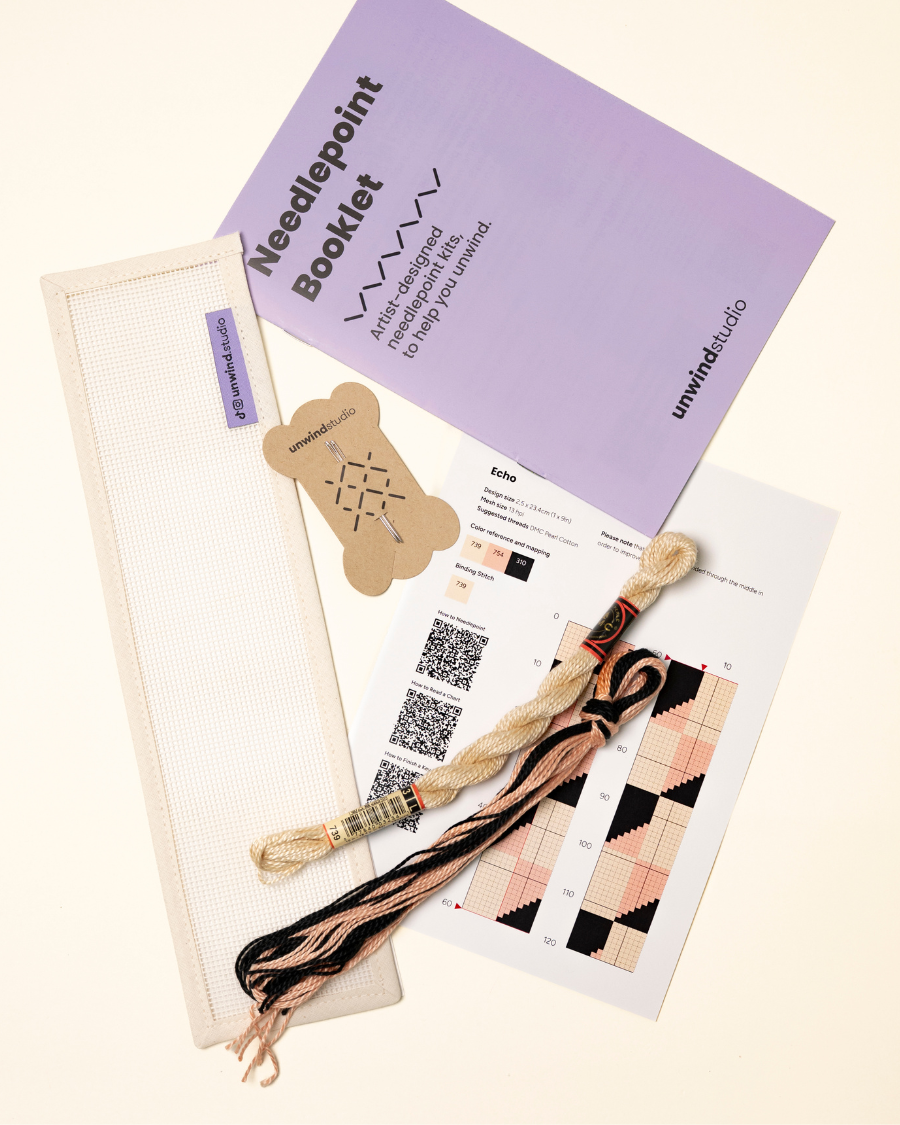flat view of the Echo Key Fob Needlepoint Kit with blank canvas, matching threads and instructional booklet