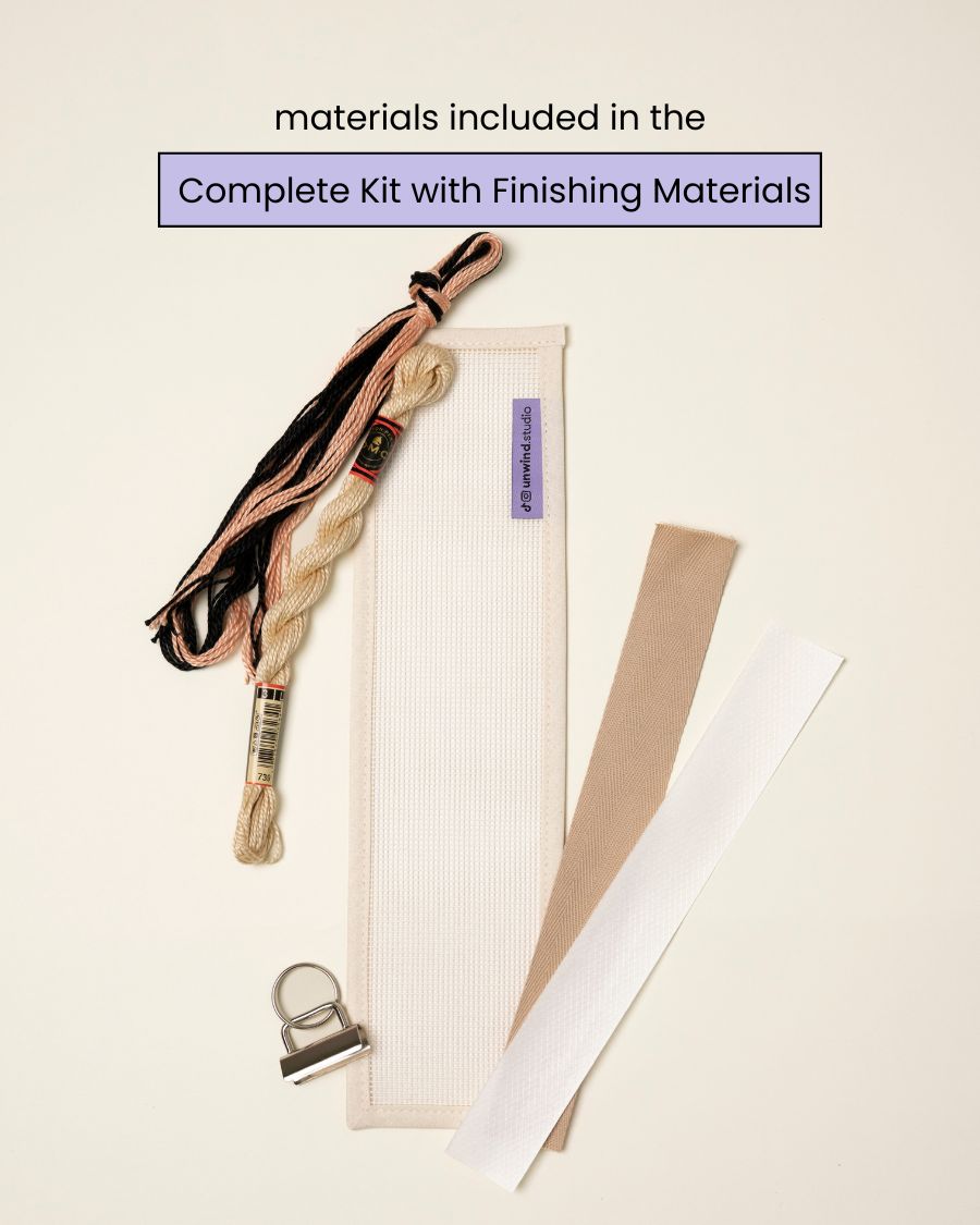 flat view of the Echo Key Fob Needlepoint Kit with blank canvas, matching threads and finishing materials.