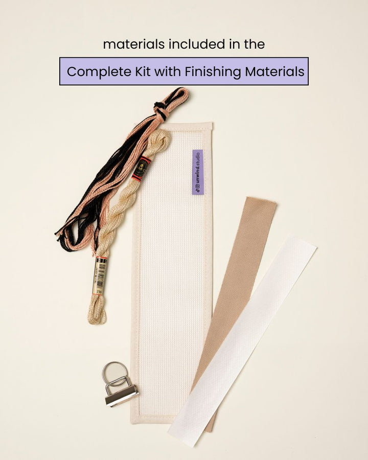 flat view of the Echo Key Fob Needlepoint Kit with blank canvas, matching threads and finishing materials.