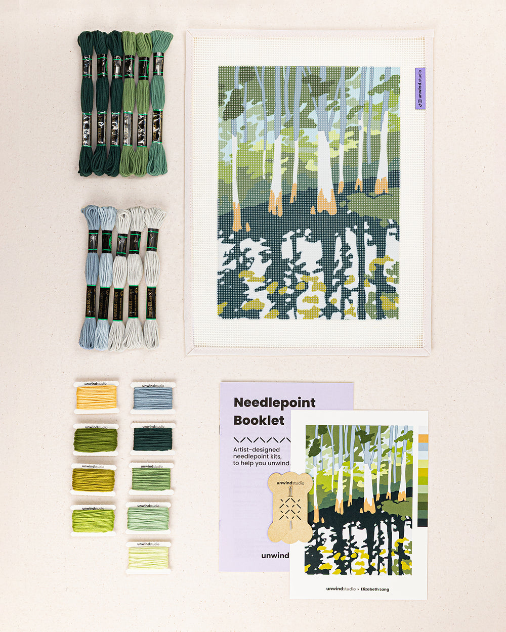 everglade cypress needlepoint kit contents: printed canvas, threads, needles, and instruction booklet, graphic flyer laid flat
