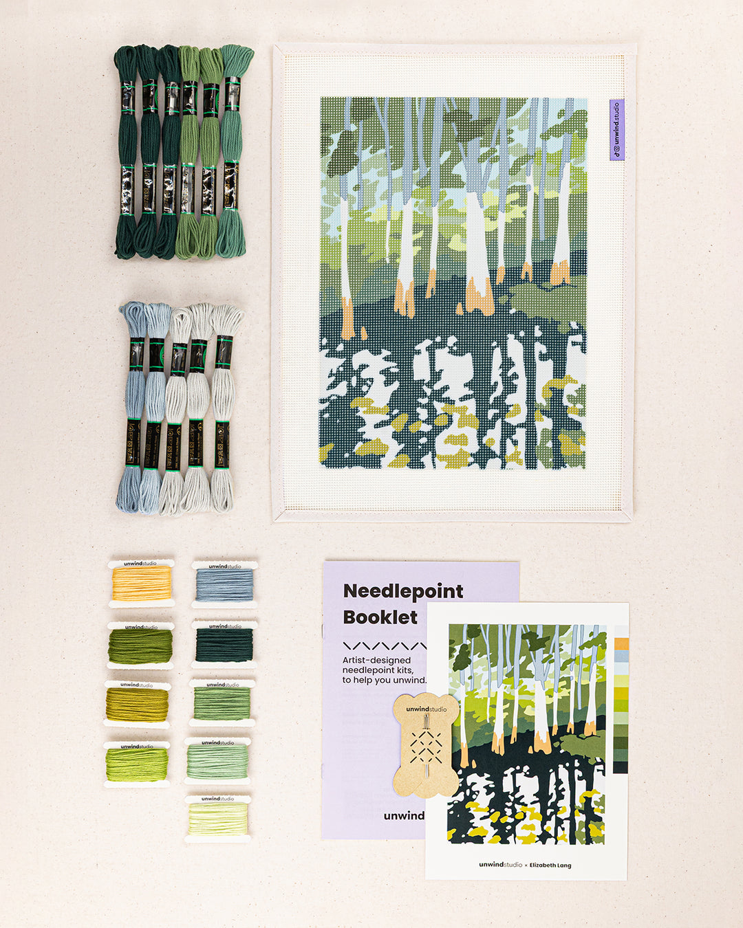 everglade cypress needlepoint kit contents: printed canvas, threads, needles, and instruction booklet, graphic flyer laid flat