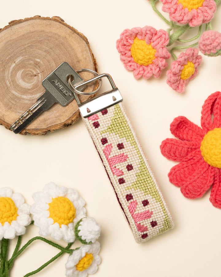 Flourish Key Fob with crochet flowers in the background
