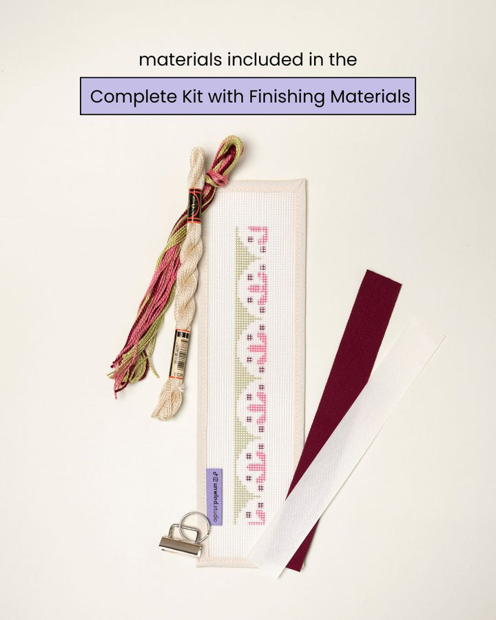 flat view of the Flourish Key Fob Needlepoint Kit with printed canvas, matching threads and finishing materials.