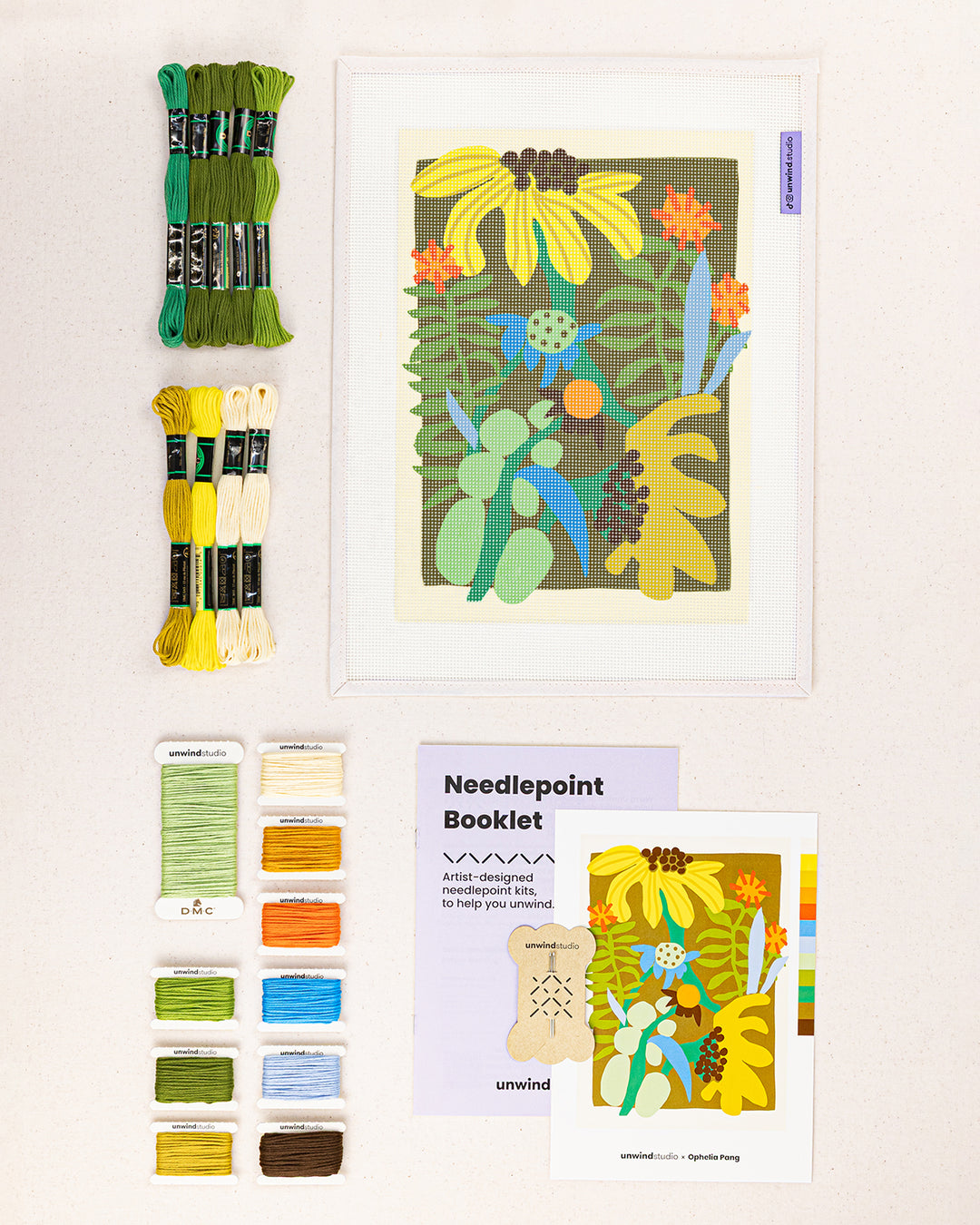 flower market needlepoint kit contents: printed canvas, threads, needles, and instruction booklet, graphic flyer laid flat