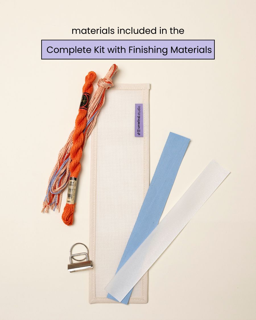 flat view of the Focus Key Fob Needlepoint Kit with blank canvas, matching threads and finishing materials.