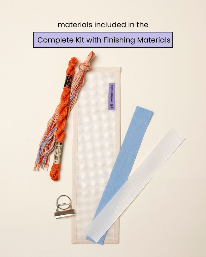flat view of the Focus Key Fob Needlepoint Kit with blank canvas, matching threads and finishing materials.