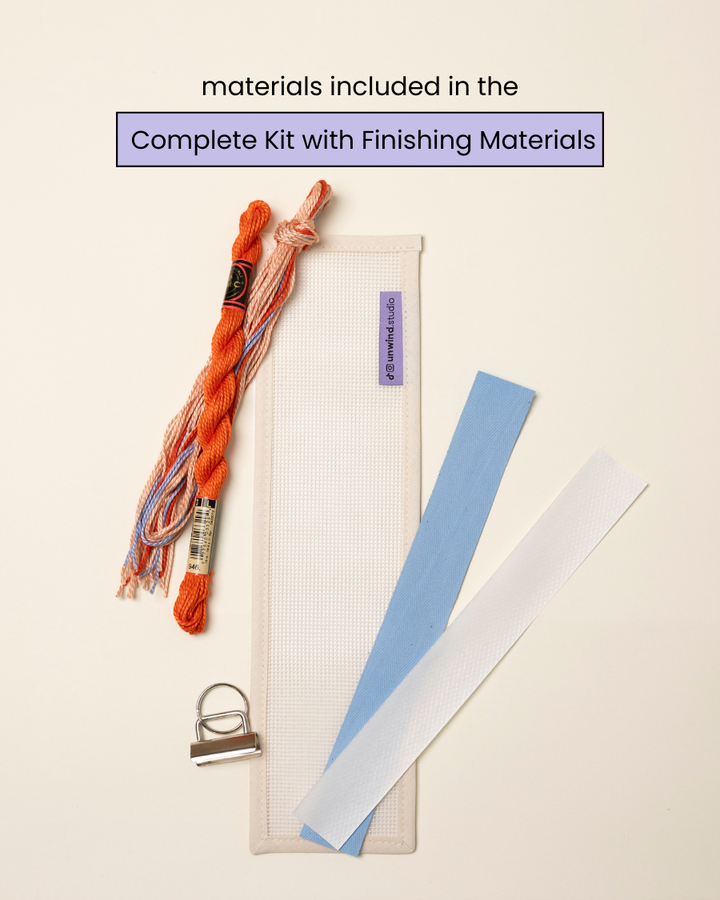 flat view of the Focus Key Fob Needlepoint Kit with blank canvas, matching threads and finishing materials.