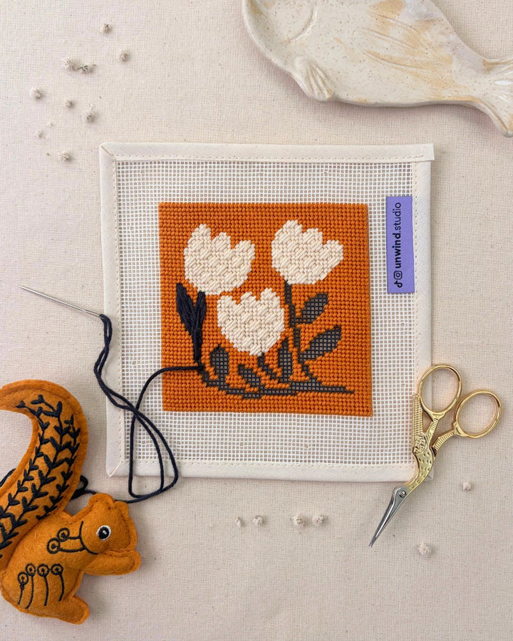 Golden tulips needlepoint coasters by diana pereira in progress with decorative elements