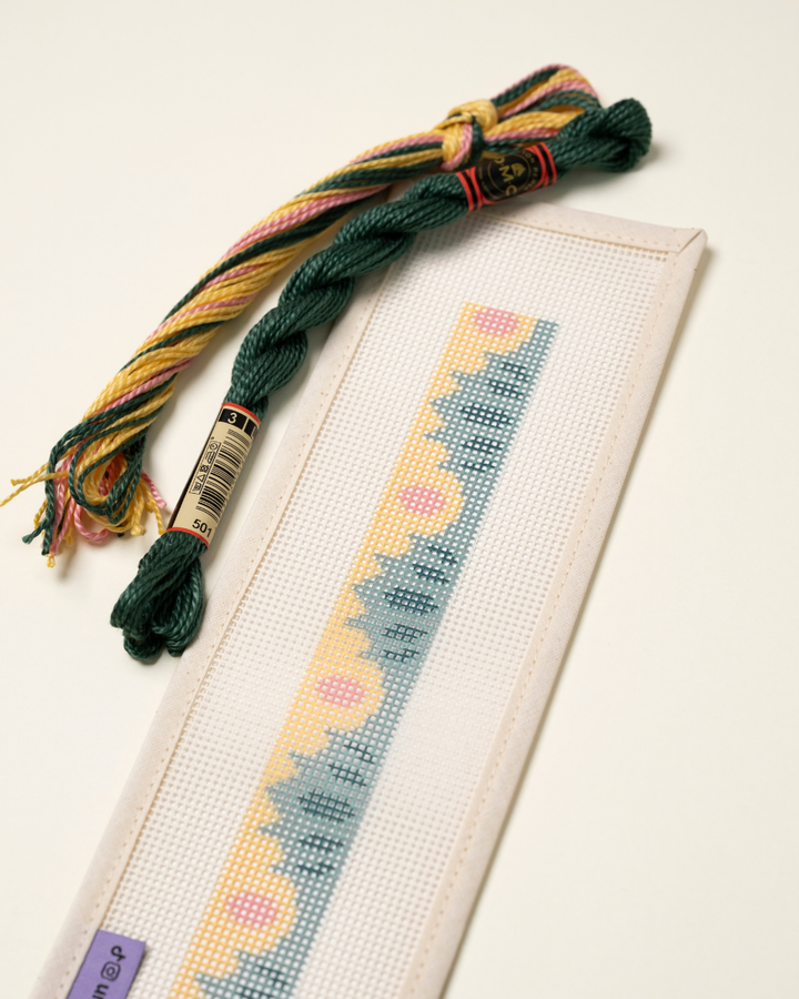 Up-close view of the High Seas Key Fob Needlepoint Kit with matching threads