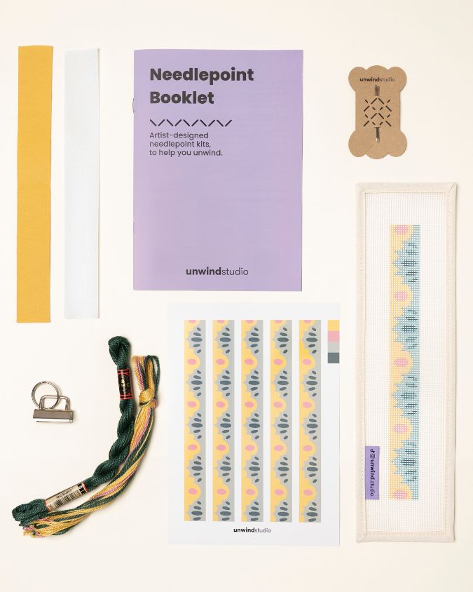 High Seas Complete Needlepoint Kit with finishing materials such as fusible web and cotton twill tape, key fob hardware plus matching threads, set of needles, a graphic flyer and a instructional booklet.