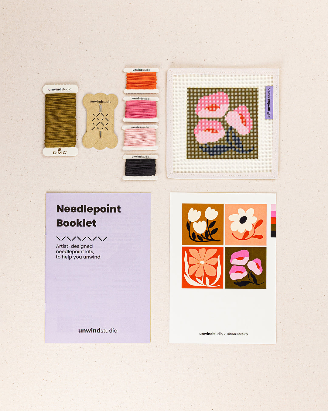Pink Poppies Coaster needlepoint kit contents: printed canvas, threads, needles, and instruction booklet, graphic flyer laid flat
