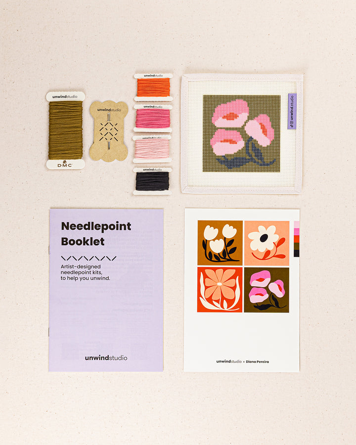 Pink Poppies Coaster needlepoint kit contents: printed canvas, threads, needles, and instruction booklet, graphic flyer laid flat