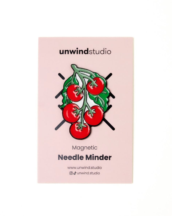 The unwind studio needle minder pomodoro magnet place on a personalized card.

