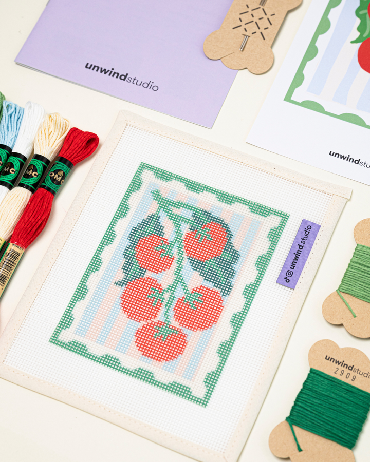 diagonal up-close view of the unwind studio pomodoro needlepoint stamp.