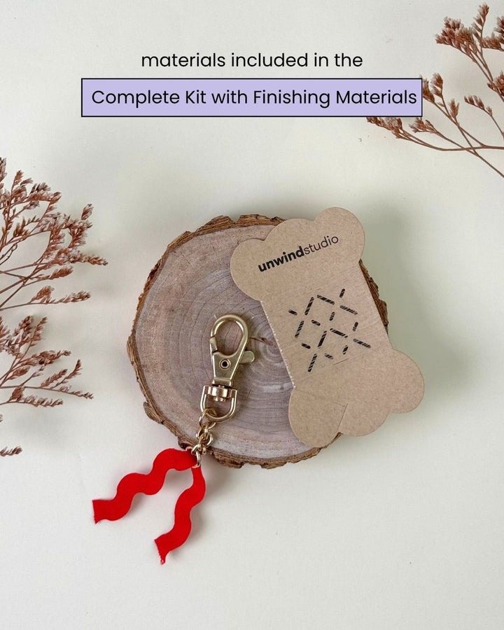 Romance book bag charm finishing materials such as hardware with a hanging red fabric and invisible thread