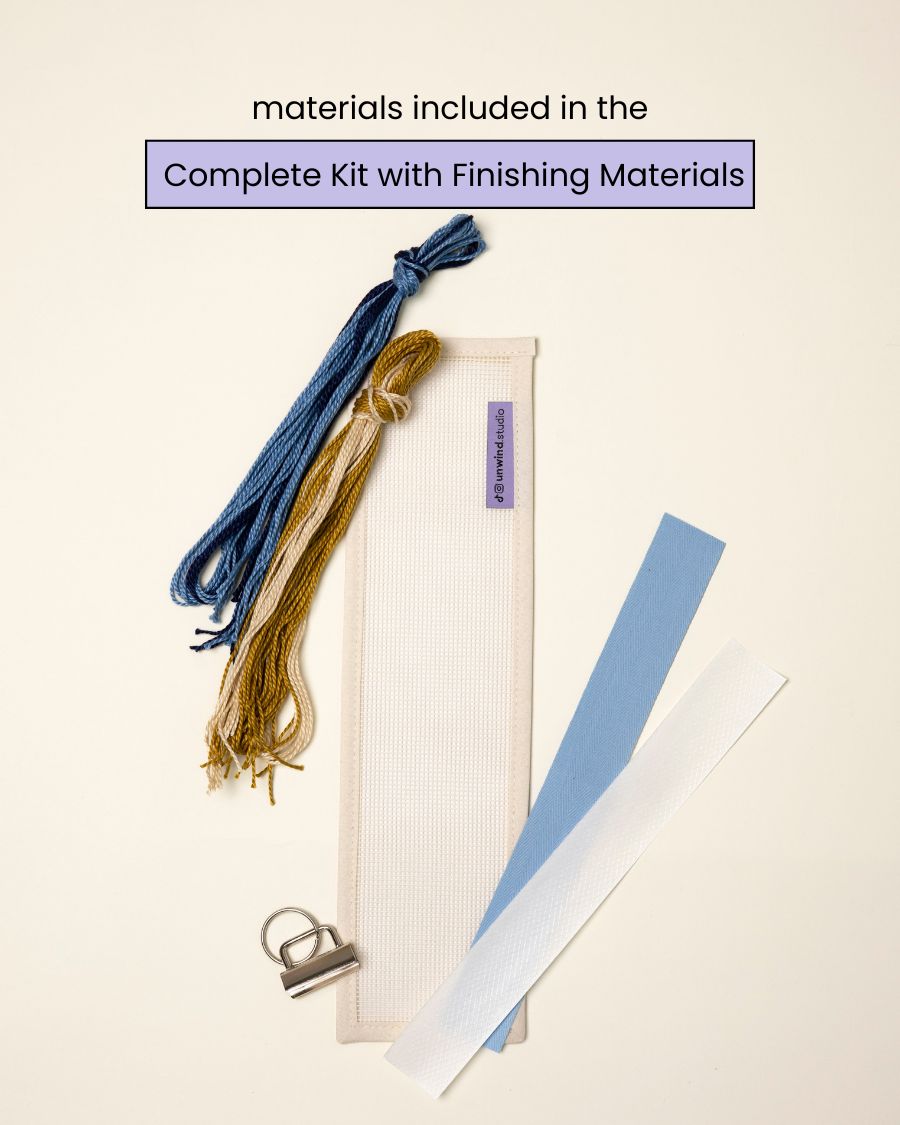 flat view of the Summit Key Fob Needlepoint Kit with blank canvas, matching threads and finishing materials.