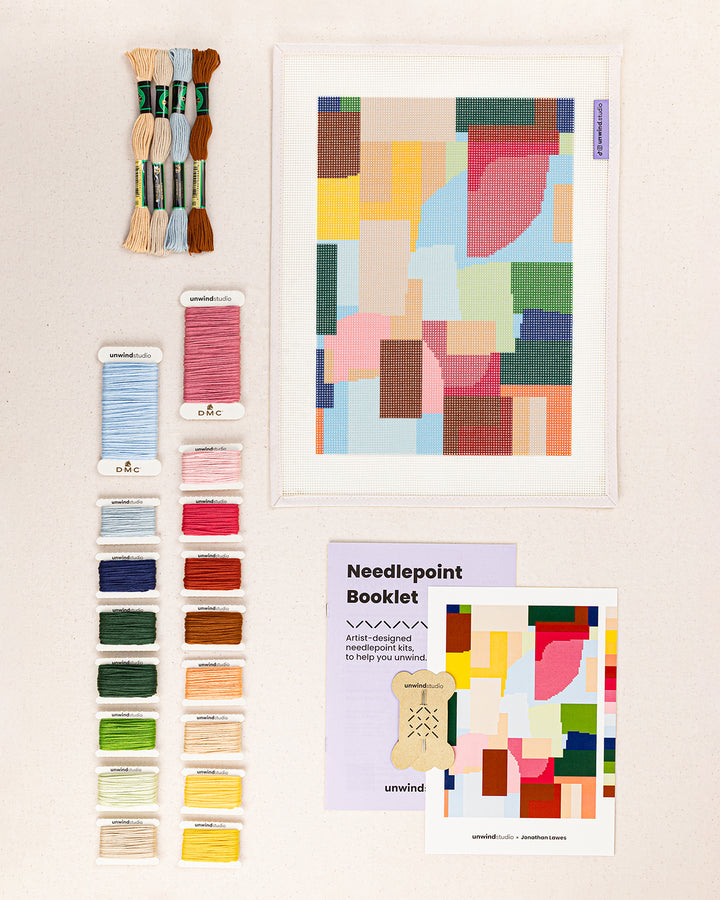 yateley needlepoint kit contents: printed canvas, threads, needles, and instruction booklet, graphic flyer laid flat