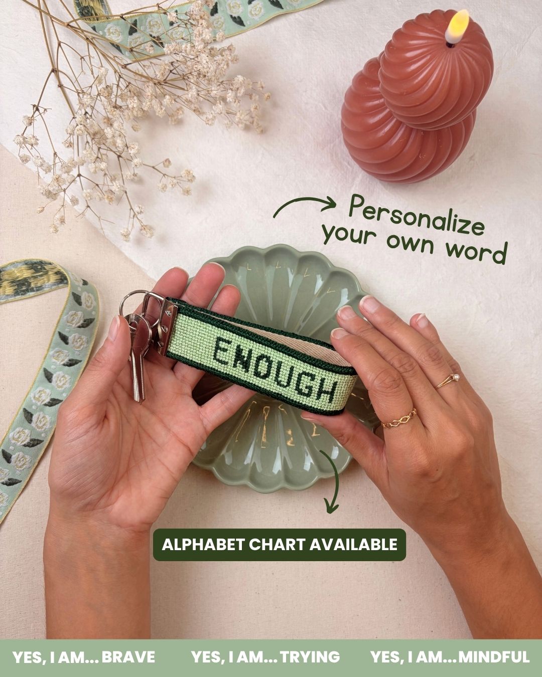 finished "yes, i am" needlepoint key fob with the suggested word "enough"