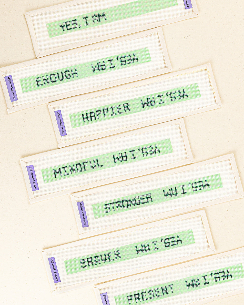a collection of the "yes, i am" needlepoint key fob canvases with the blank option to fill with our own affirmation word or a selection of 6 words printed