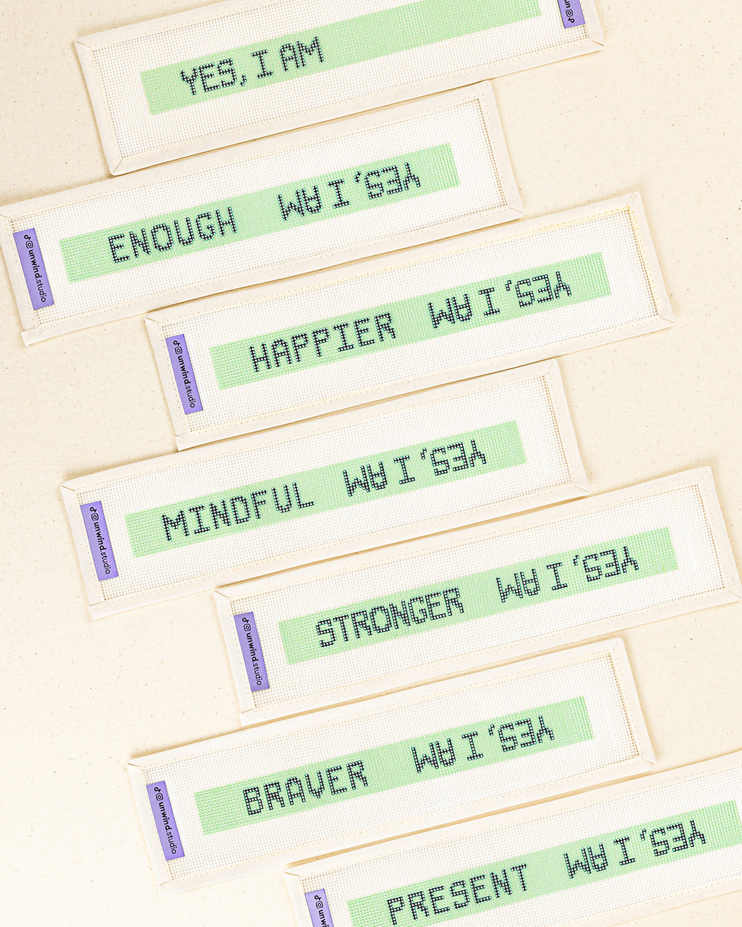 a collection of the "yes, i am" needlepoint key fob canvases with the blank option to fill with our own affirmation word or a selection of 6 words printed