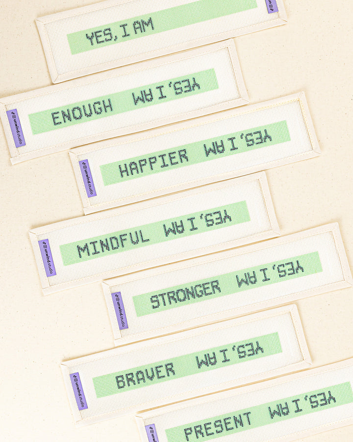 a collection of the "yes, i am" needlepoint key fob canvases with the blank option to fill with our own affirmation word or a selection of 6 words printed
