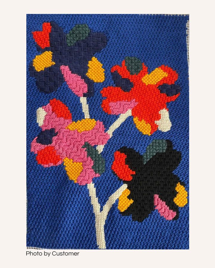 four flowers needlepoint canvas, done by a customer