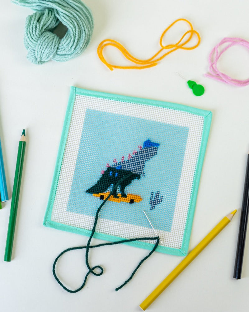 An easy beginner needlepoint kit of a hippo that is stitch-painted onto 7  mesh needlepoint canvas. The design area measures 9 x 9 and it comes with  tapestry wool and how to