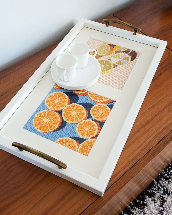 tray with framed needlepoint of oranges and lemons