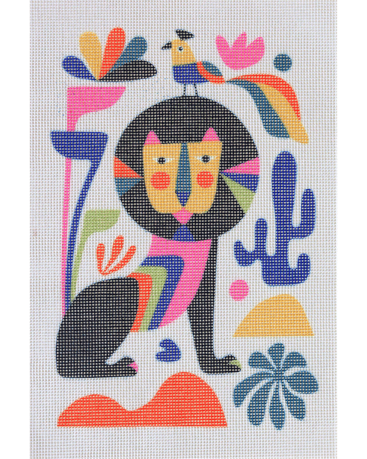 Needlepoint canvas with illustration of colorful lion and bird