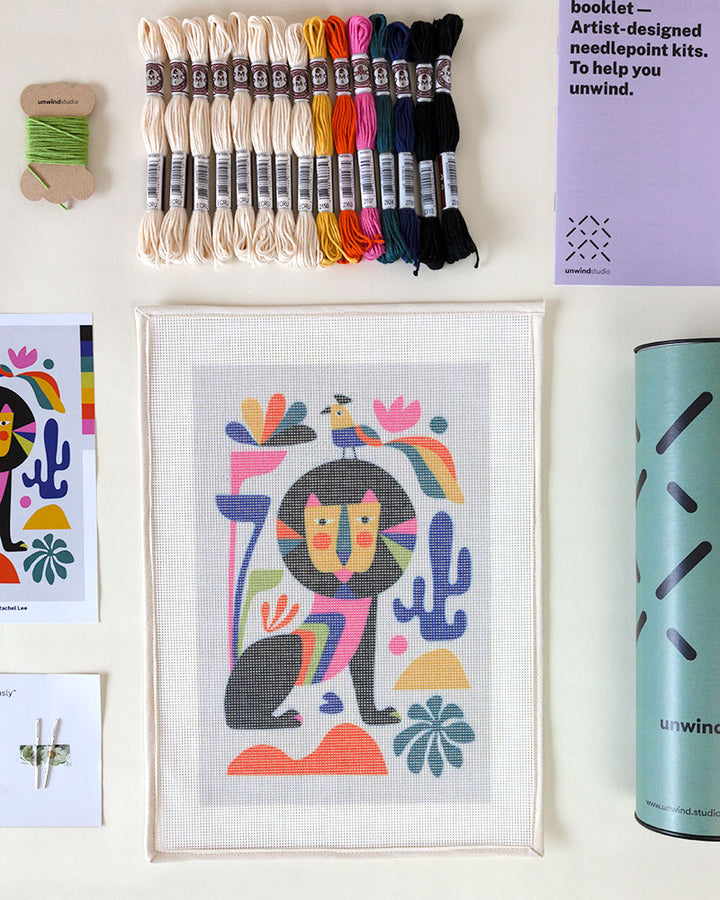 Needlepoint kit with illustration of colorful lion and bird