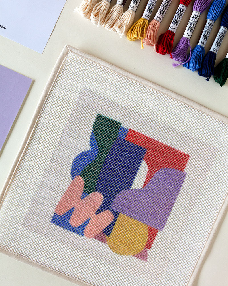 Needlepoint canvas with illustration of abstract shapes and colors
